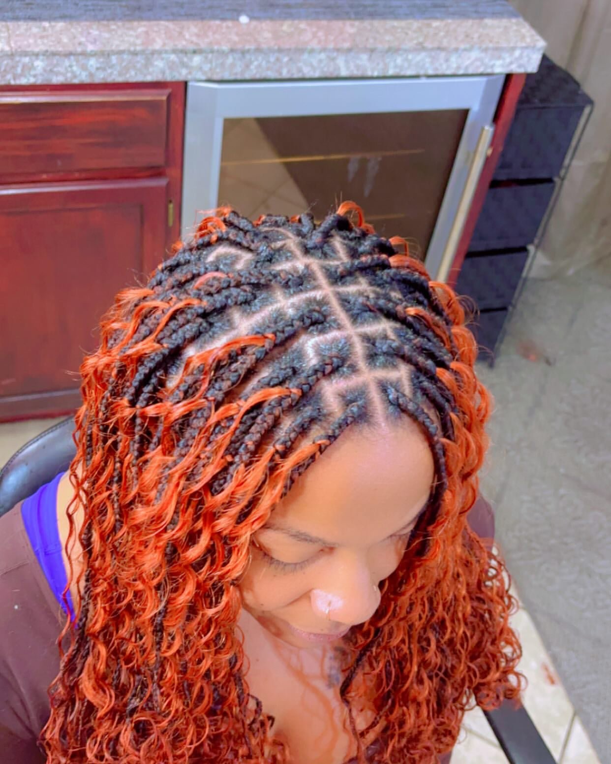 Goddess braids with orange curly ends